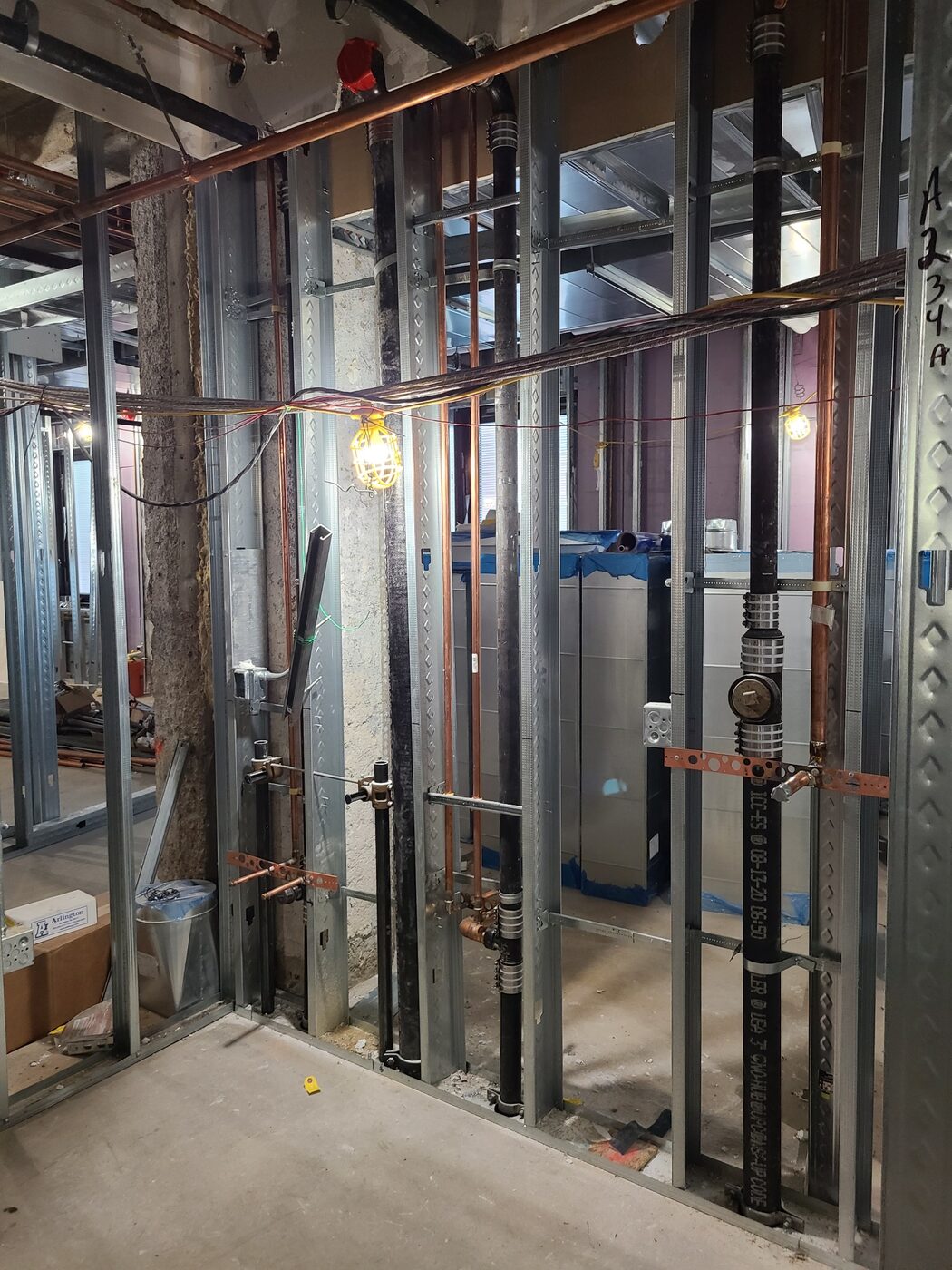 Commercial plumbing rough-in within metal stud walls