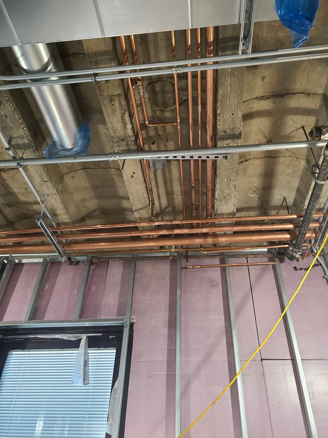 Overhead copper piping installation