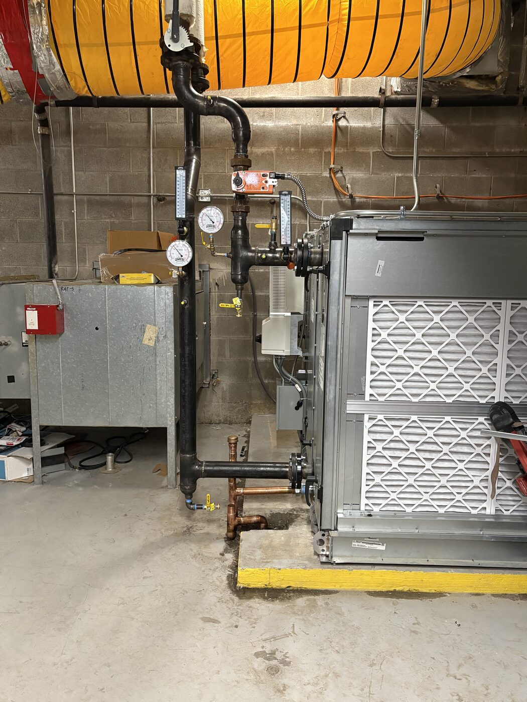 Piping connections at commercial mechanical equipment